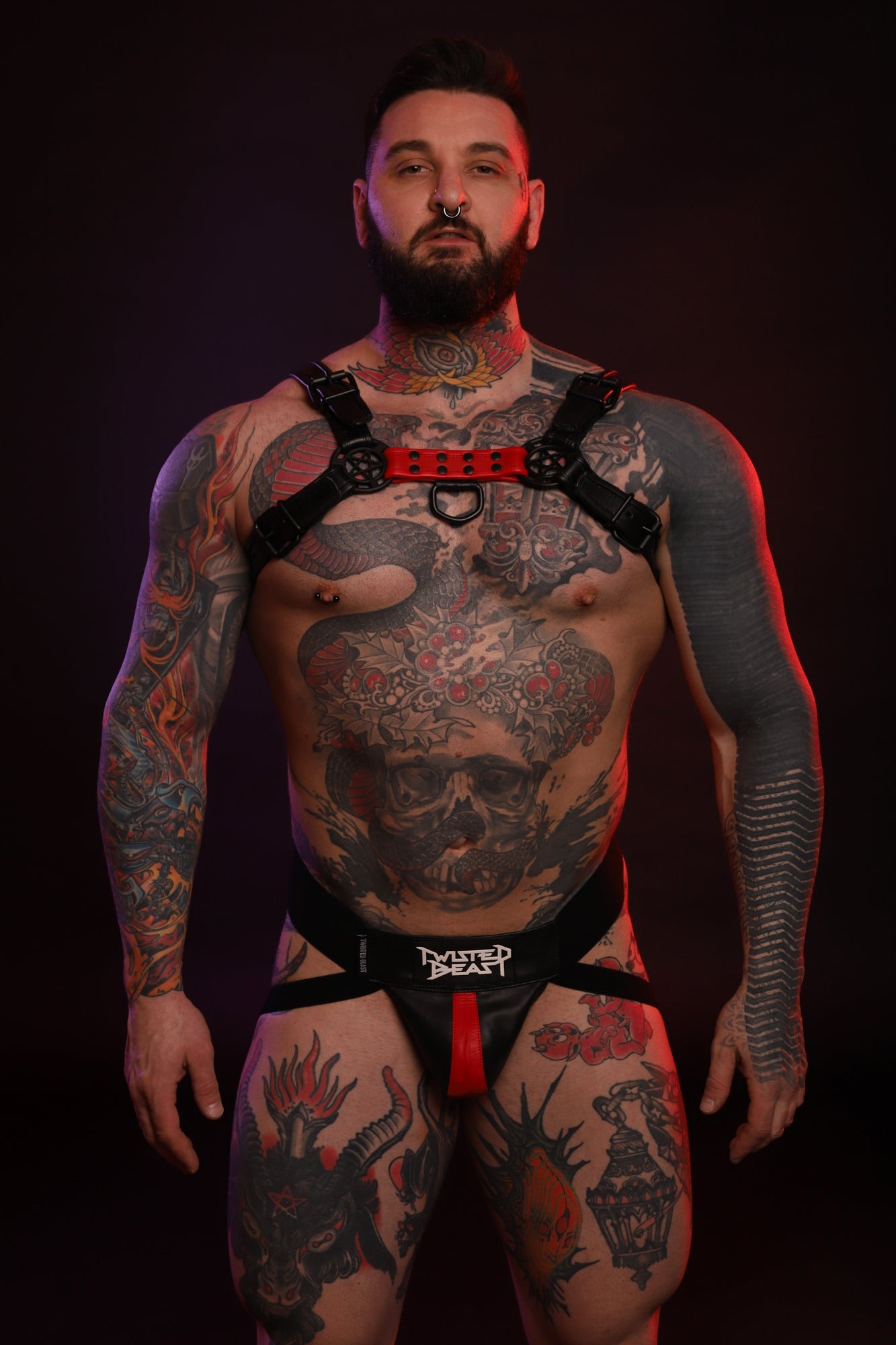 A fully front product photo of a red Beast Harness by Twisted Beast.