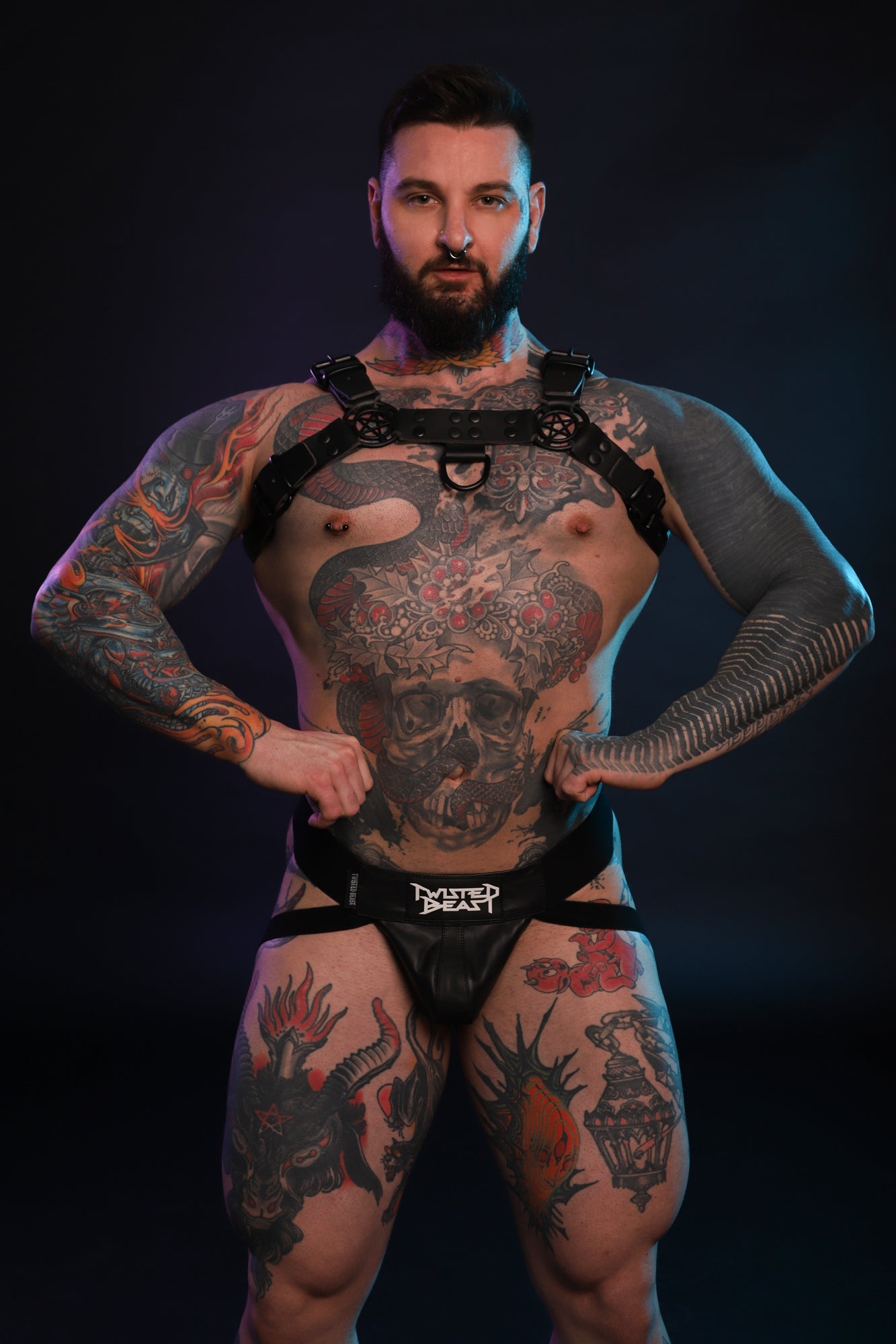 A front shot of a model wearing a Twisted Beast Beef Harness in black.