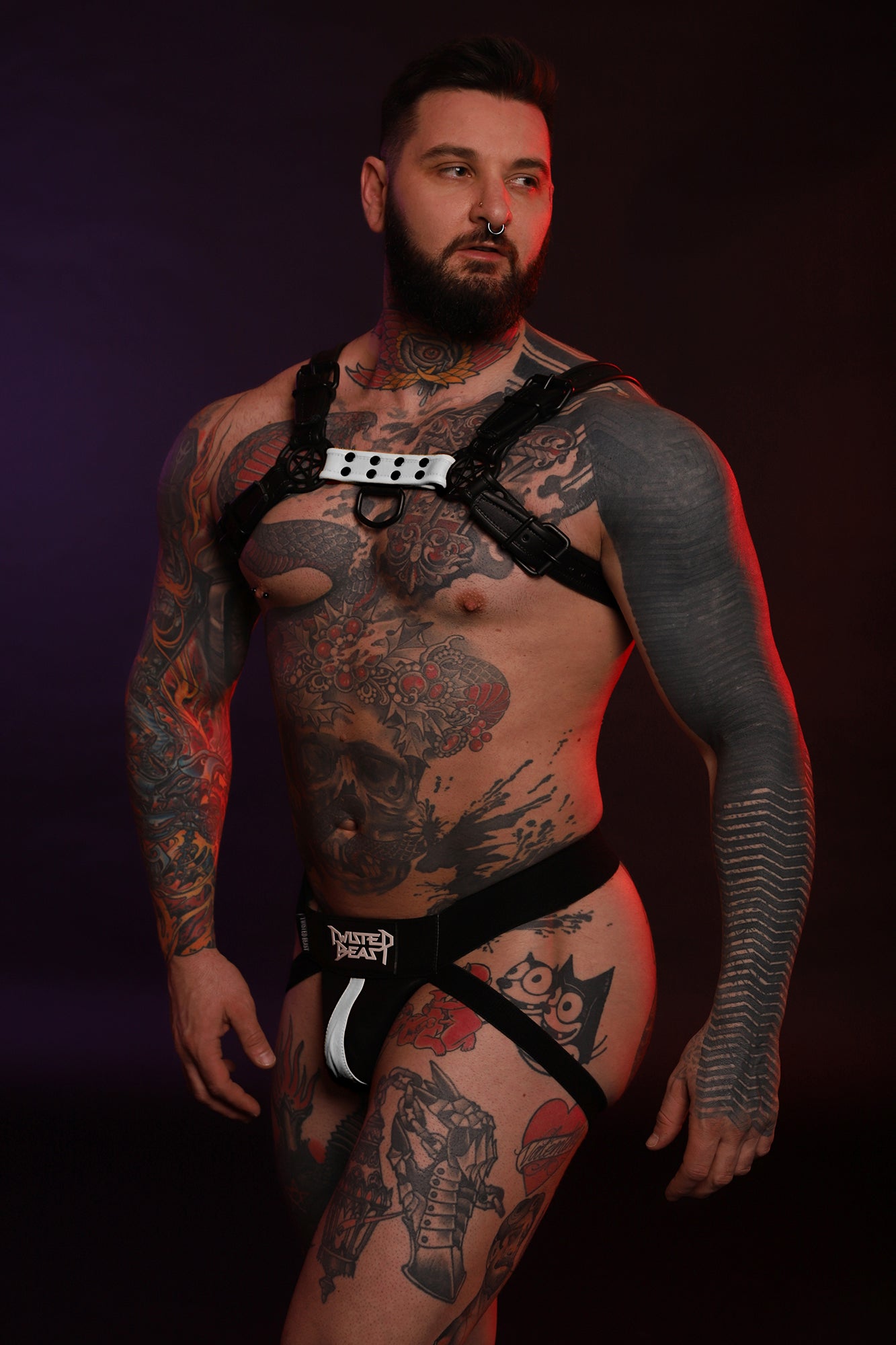 A front on product photo on a model of a Beast Harness in white by Twisted Beast.