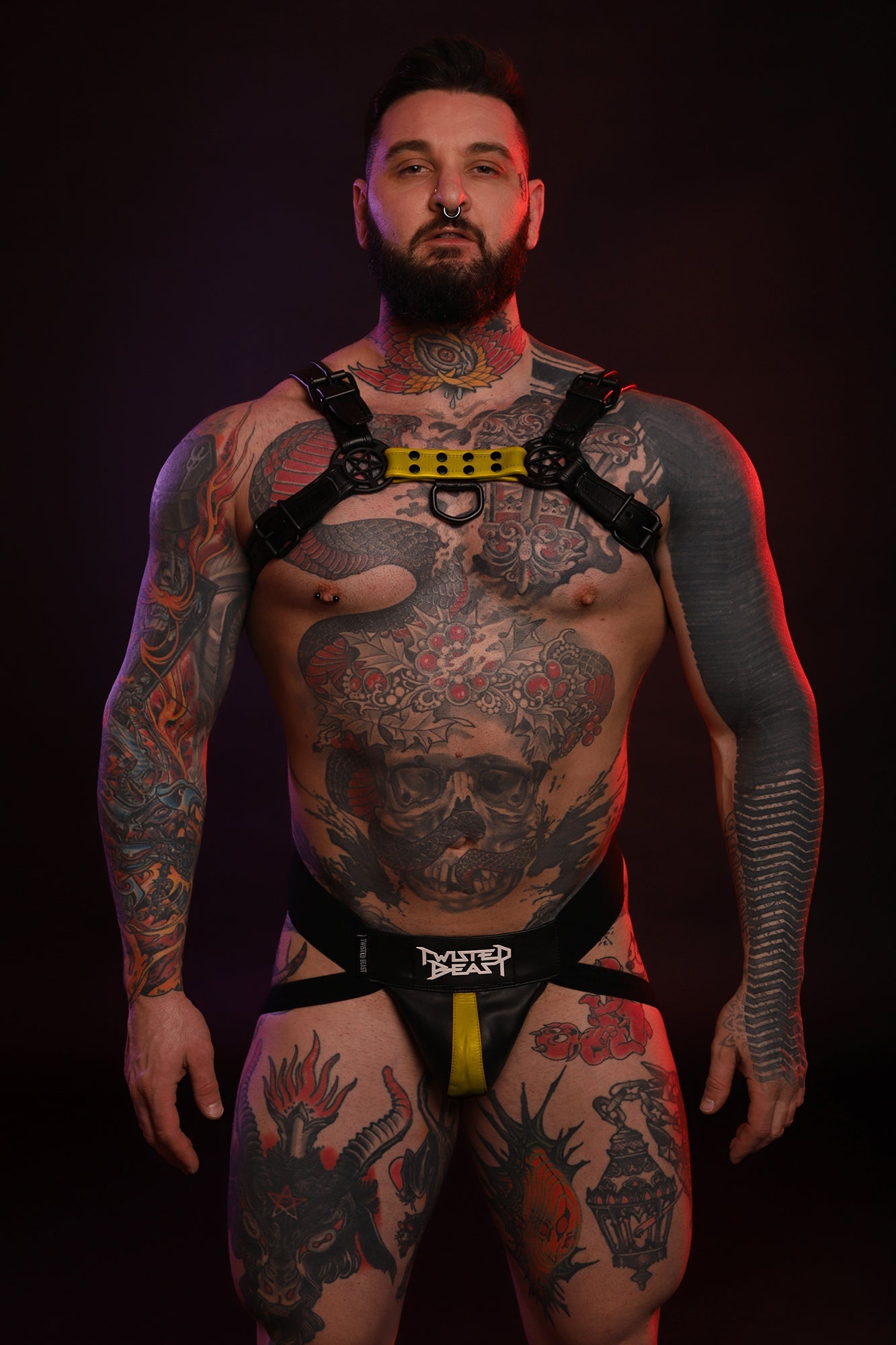 A product photo of a model wearing a Beast Jock and Harness combo in yellow.