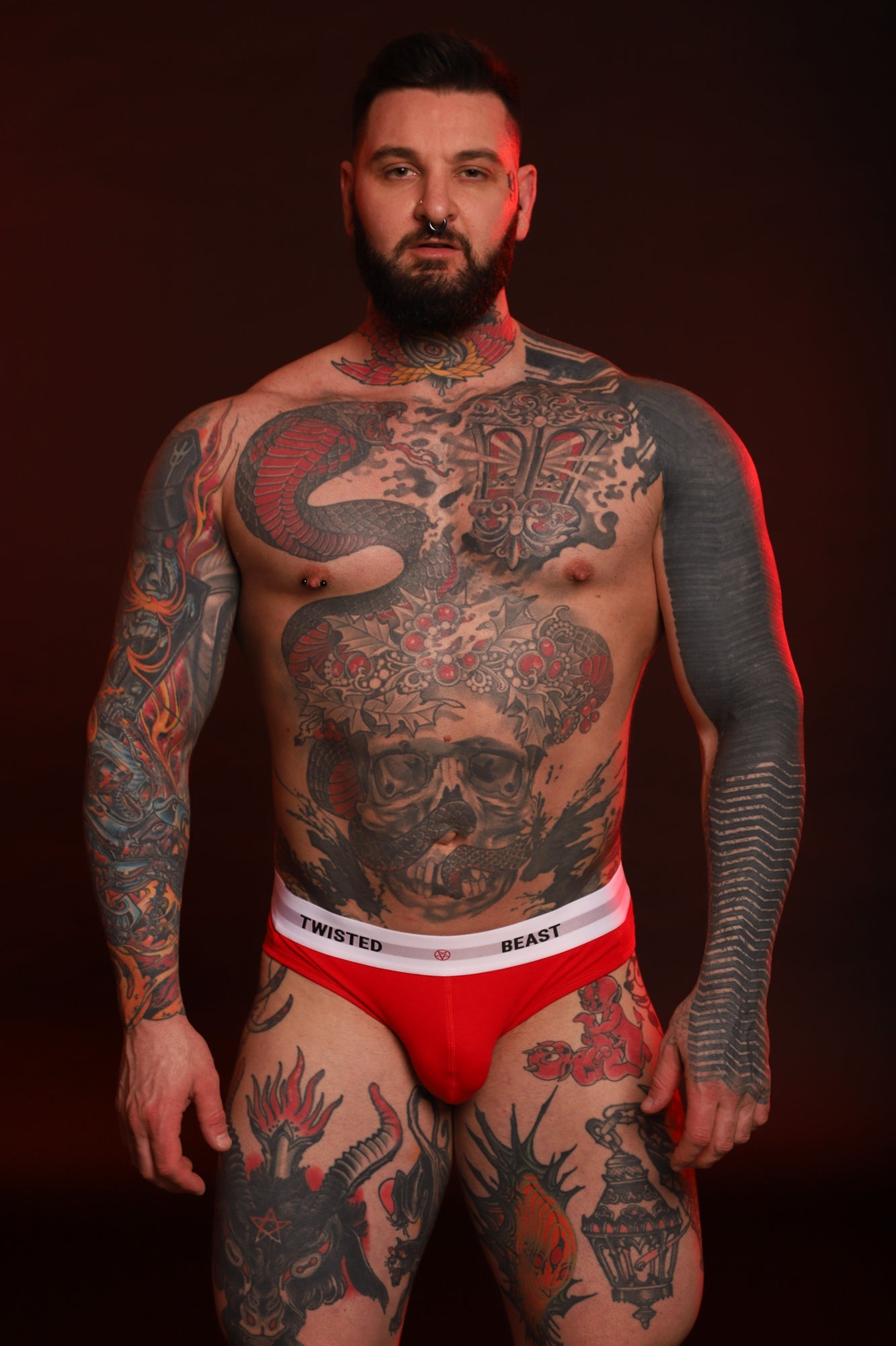 A front photo of a model wearing red Insignia Brief's.