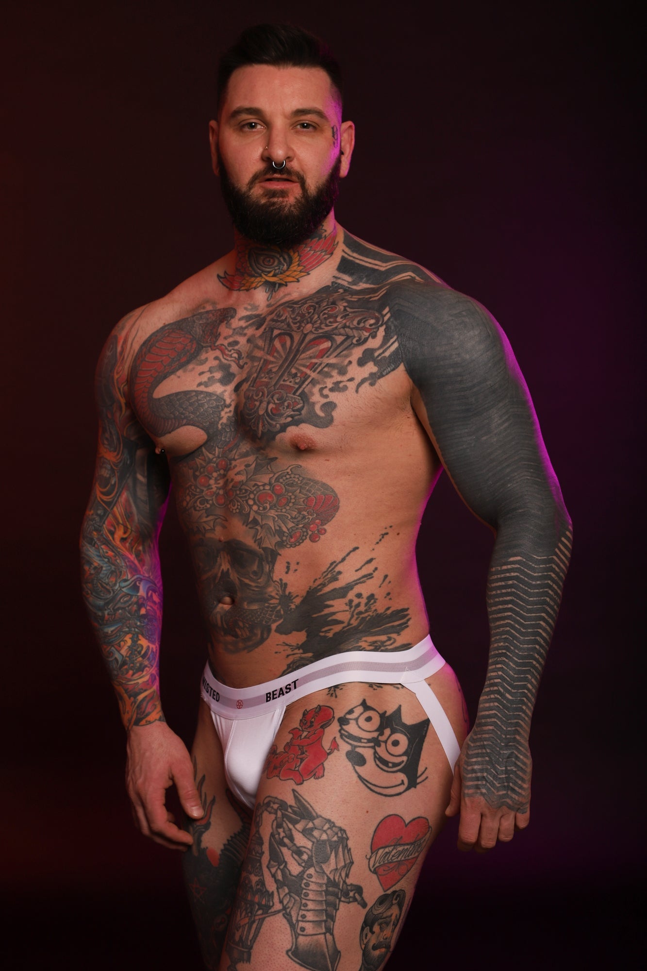 A model looking into the camera wearing a white Insignia Jock by Twisted Beast