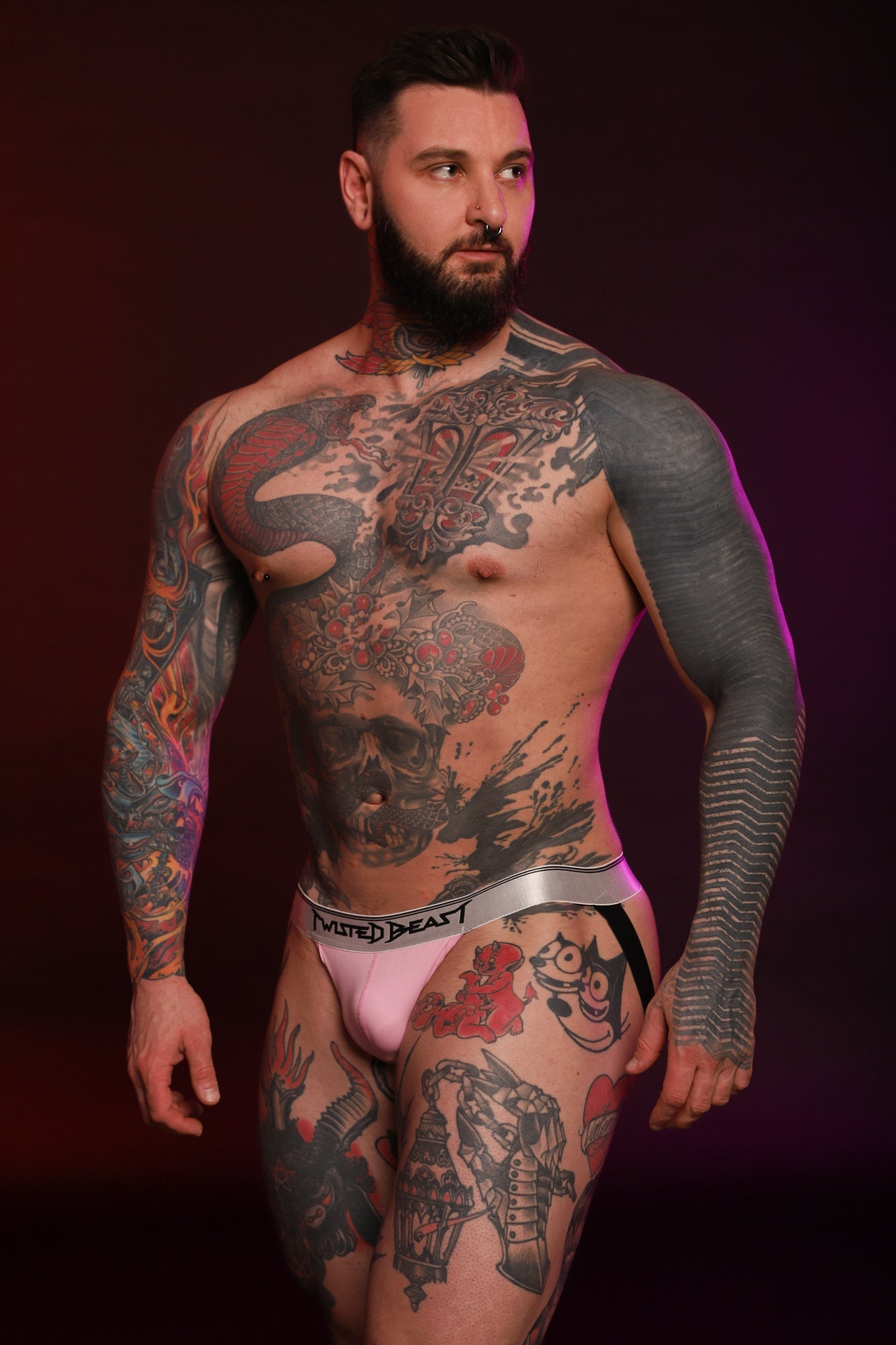 A model wearing a pink Y2K Jock and looking to the right.